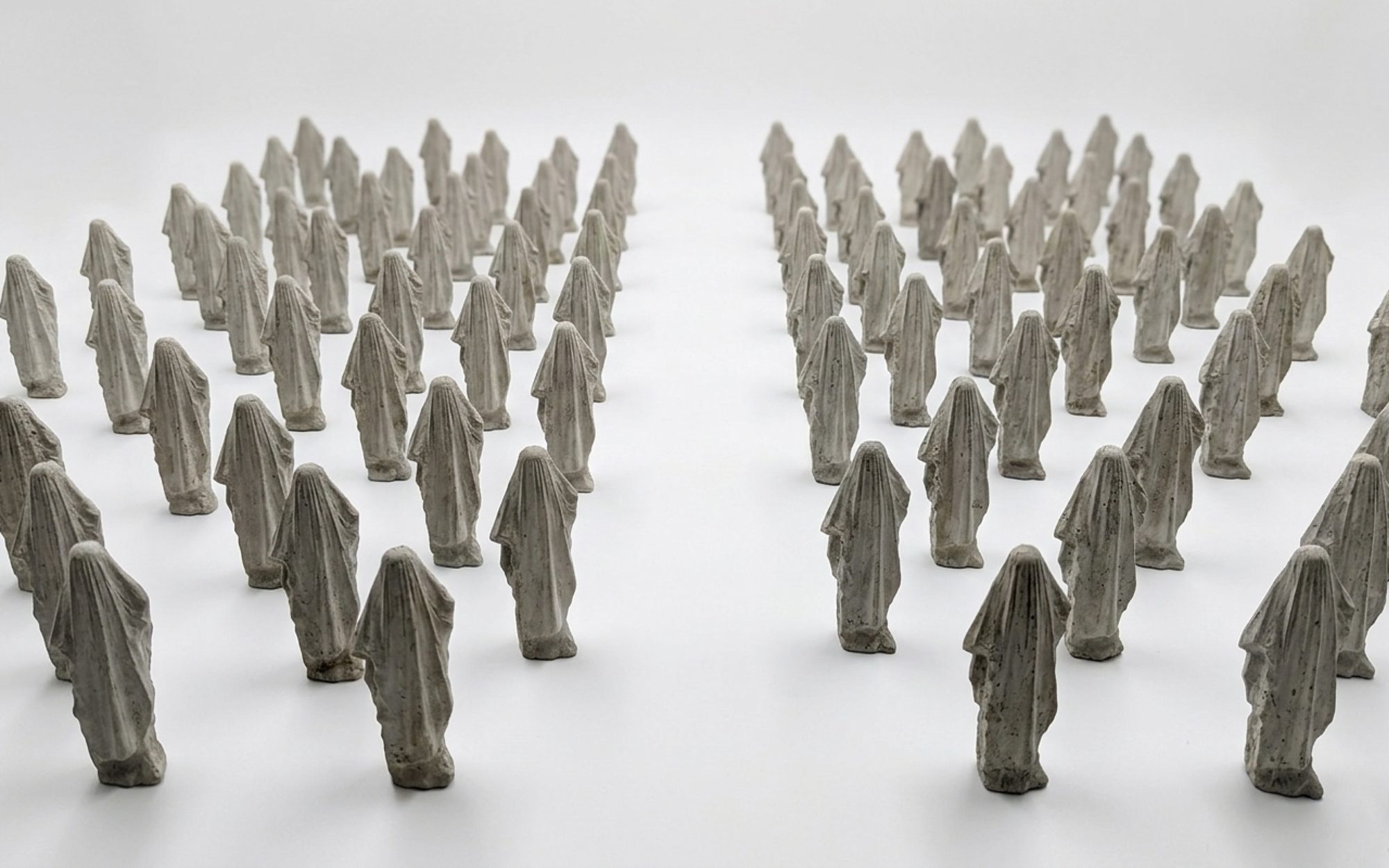 Standardised Consolation Device, cement figures arranged in rows